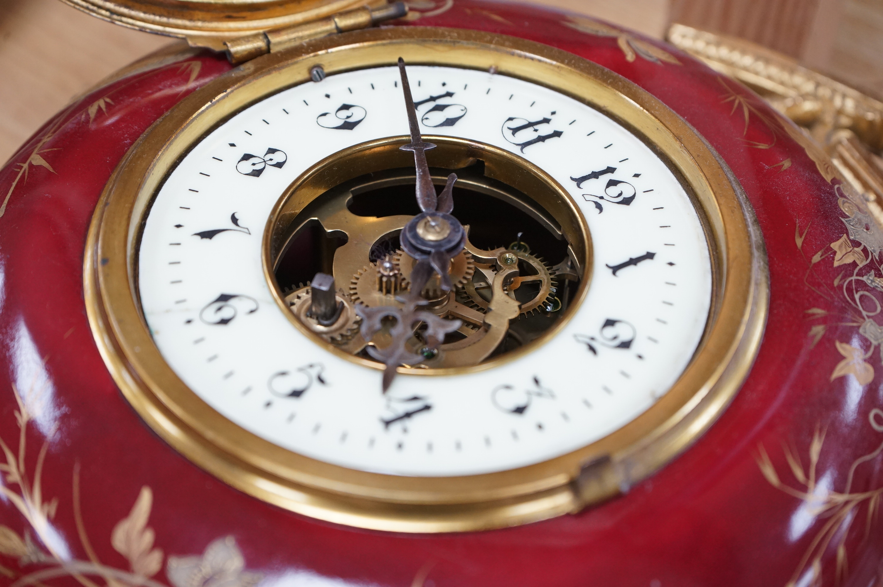 A late 19th century French hanging enamel and gilt metal wall clock. 38cm high without chain. Condition - fair to good